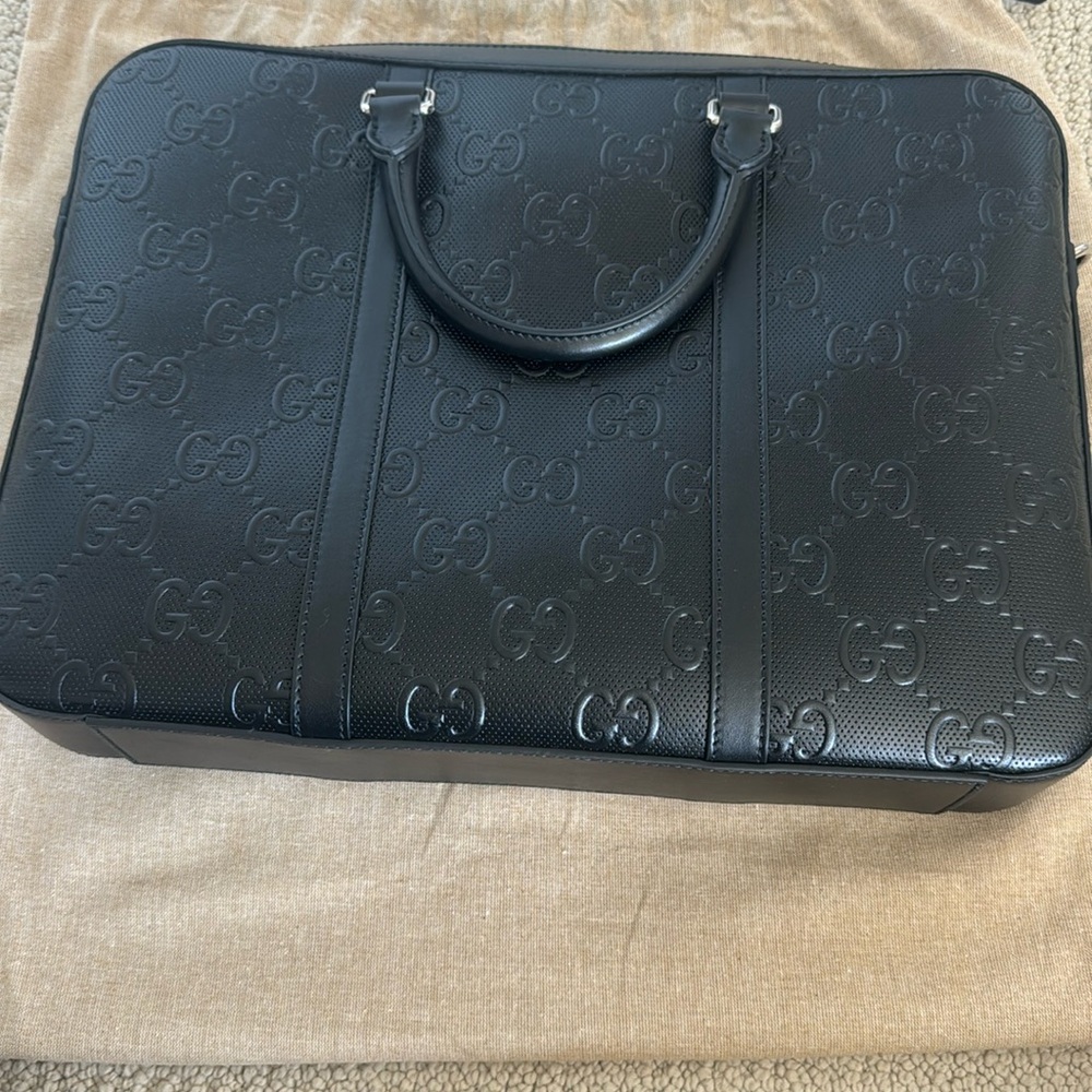New-Gucci leather bag. Can be used for work or travel. fits laptop & work files